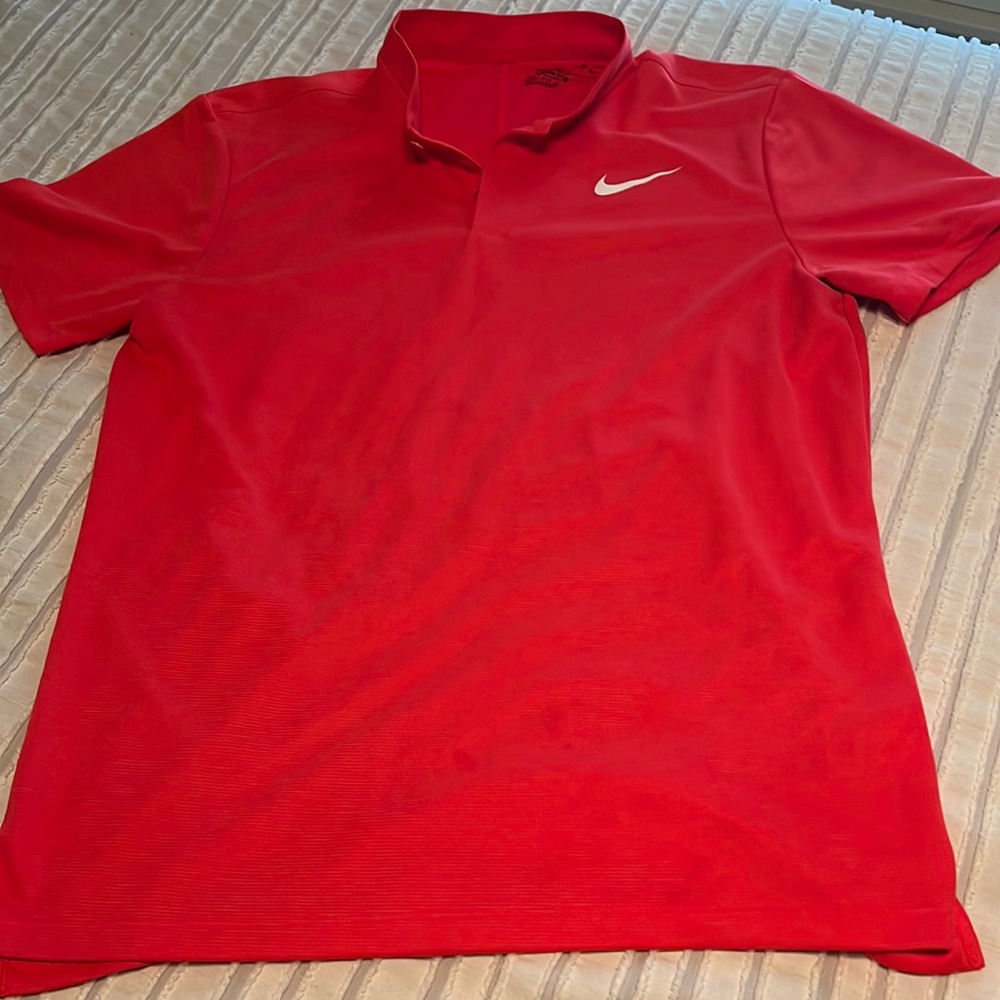 Nike Mens golf shirt. Size medium. Never worn. Pink/salmon color
